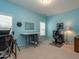 Home office space with bright blue walls, two windows, sewing desk at 1028 Dotson Way, Apex, NC 27523