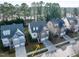 A residential neighborhood streetscape with a focus on the subject property at 1028 Dotson Way, Apex, NC 27523
