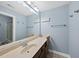 Simple bathroom featuring a vanity, a sink, and an illuminated mirror at 109 Skywater Ln, Holly Springs, NC 27540