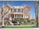 Charming brick two-story home with a manicured lawn and a welcoming front porch at 109 Skywater Ln, Holly Springs, NC 27540