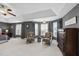 Spacious main bedroom features high ceilings, seating area and a large bay window for natural light at 109 Skywater Ln, Holly Springs, NC 27540