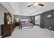 Spacious main bedroom with neutral colors, tray ceilings, and elegant furnishings at 109 Skywater Ln, Holly Springs, NC 27540