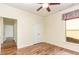 Bright bedroom with hardwood floors, double doors, and a window at 1100 Gaston Manor Dr, Durham, NC 27703