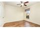 Cozy bedroom with a ceiling fan, hardwood floors, and a window at 1100 Gaston Manor Dr, Durham, NC 27703