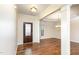 Elegant foyer with hardwood floors, decorative door, and views into dining and living areas at 1100 Gaston Manor Dr, Durham, NC 27703