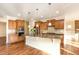 Well-lit kitchen featuring custom cabinetry, stainless steel appliances, and granite countertops at 1100 Gaston Manor Dr, Durham, NC 27703