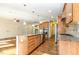 Open kitchen with wood cabinets, granite countertops, and stainless steel appliances at 1100 Gaston Manor Dr, Durham, NC 27703