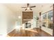 Bright living room with stone fireplace, built-in shelves, and hardwood floors at 1100 Gaston Manor Dr, Durham, NC 27703