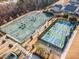 Aerial view of tennis and pickle ball courts in a beautiful neighborhood at 1100 Gaston Manor Dr, Durham, NC 27703