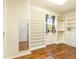 Walk-in closet with custom built-in shelving, drawers, and a mirror at 1100 Gaston Manor Dr, Durham, NC 27703