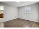Cozy bedroom with hardwood floors, natural light from a window, and neutral paint at 11254 Hwy Nc 50, Benson, NC 27504