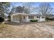 The exterior features a charming ranch home with a white painted brick and well-maintained landscaping at 11254 Hwy Nc 50, Benson, NC 27504