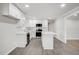 Bright kitchen with white cabinetry, modern appliances, subway tile backsplash, and an island with countertop seating at 11254 Hwy Nc 50, Benson, NC 27504