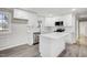 The chef's kitchen boasts stainless appliances, custom cabinetry, and a center island with stone countertops at 11254 Hwy Nc 50, Benson, NC 27504