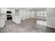 The kitchen and living room combine in an open-concept space at 11254 Hwy Nc 50, Benson, NC 27504