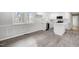 An open concept eat-in kitchen includes recessed lights, white cabinets, stainless appliances and stone countertops at 11254 Hwy Nc 50, Benson, NC 27504