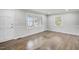 Sunlit living room featuring freshly painted walls, refinished floors, and updated trim at 11254 Hwy Nc 50, Benson, NC 27504