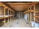 Interior view of the shed featuring exposed wood framing and built-in shelving for storage at 11254 Hwy Nc 50, Benson, NC 27504