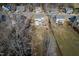 An aerial view of a home featuring a fenced backyard with a playset, patio, and generous lawn at 115 Lockamy Ln, Youngsville, NC 27596