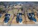 An aerial view displays a neighborhood featuring well-maintained homes and expansive, tree-lined yards at 115 Lockamy Ln, Youngsville, NC 27596