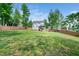 Large, fenced backyard with a playset and plenty of room to play at 115 Lockamy Ln, Youngsville, NC 27596