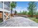 Large stamped concrete patio extends outdoor living space in fenced backyard at 115 Lockamy Ln, Youngsville, NC 27596