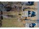 An aerial view showing an expansive backyard with an outdoor firepit and patio area at 115 Lockamy Ln, Youngsville, NC 27596