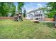 Expansive backyard with play set, patio, and lush green grass at 115 Lockamy Ln, Youngsville, NC 27596