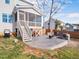 Enjoy outdoor living on this backyard stamped concrete patio with a stone fire pit and screened in porch at 115 Lockamy Ln, Youngsville, NC 27596