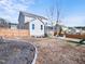 Fenced backyard featuring a screened-in porch, stone patio with fire pit, and playground at 115 Lockamy Ln, Youngsville, NC 27596