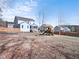 Spacious fenced backyard featuring a play set, fire pit, and screened porch at 115 Lockamy Ln, Youngsville, NC 27596