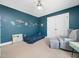 bedroom features celestial themed wall and carpeted floor, perfect for children at 115 Lockamy Ln, Youngsville, NC 27596