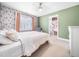 Inviting bedroom showcases a floral accent wall, plush carpet, and large closet at 115 Lockamy Ln, Youngsville, NC 27596