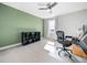 Spare bedroom features a ceiling fan and a bright window at 115 Lockamy Ln, Youngsville, NC 27596