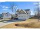 View of a two-story home with attached two-car garage and lawn at 115 Lockamy Ln, Youngsville, NC 27596