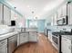 The kitchen features white cabinets, granite countertops, and stainless steel appliances at 115 Lockamy Ln, Youngsville, NC 27596