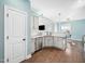 Open concept kitchen features granite countertops and stainless steel appliances at 115 Lockamy Ln, Youngsville, NC 27596