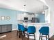 Kitchen island seating for three with pendant lighting and stainless appliances at 115 Lockamy Ln, Youngsville, NC 27596