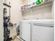 Functional laundry room with modern washer and dryer at 115 Lockamy Ln, Youngsville, NC 27596