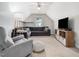 Comfortable bonus room featuring a soft gray color palette and ample seating at 115 Lockamy Ln, Youngsville, NC 27596