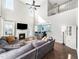 Bright living room with high ceilings, fireplace, and a view into dining area at 115 Lockamy Ln, Youngsville, NC 27596