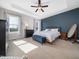 Relaxing main bedroom with a blue accent wall and plush carpeting at 115 Lockamy Ln, Youngsville, NC 27596