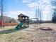 Backyard playground set with swings, slide and playhouse for hours of outdoor fun at 115 Lockamy Ln, Youngsville, NC 27596