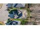 Aerial view of a well-maintained home with mature landscaping, a driveway, and a traditional roof at 12345 Beestone Ln, Raleigh, NC 27614