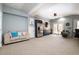 Finished basement with a refrigerator, bar, drum set, and comfortable seating, great for entertainment at 12345 Beestone Ln, Raleigh, NC 27614