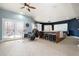Finished basement including a drum set, bar with seating, and a projection screen for entertainment at 12345 Beestone Ln, Raleigh, NC 27614