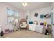 Cozy bedroom featuring a stylish accent chair and charming decor, with a light airy feel at 12345 Beestone Ln, Raleigh, NC 27614