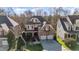 Charming brick and siding home with a two-car garage and well-manicured lawn at 12345 Beestone Ln, Raleigh, NC 27614