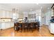 Spacious kitchen featuring a large island with seating, stainless steel appliances, and custom cabinetry at 12345 Beestone Ln, Raleigh, NC 27614