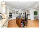 Well-appointed kitchen with a central island, granite countertops, and stainless steel appliances at 12345 Beestone Ln, Raleigh, NC 27614